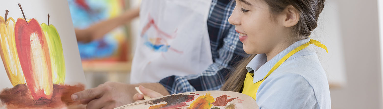 A female student in an art class at a private school